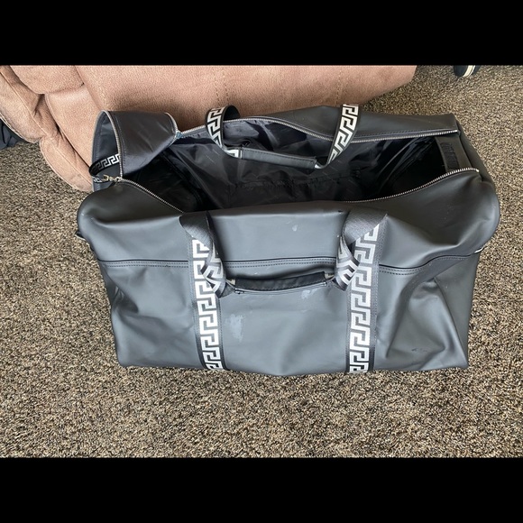 I am selling a Versace duffel bag. It is silver and black. - Picture 6 of 7